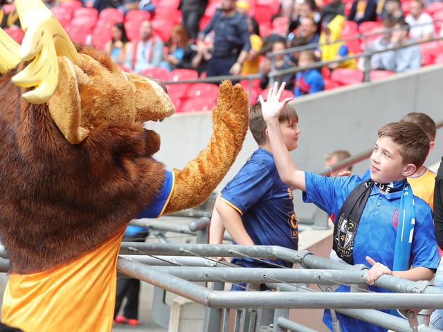 Sammy the Stag gets a high five.