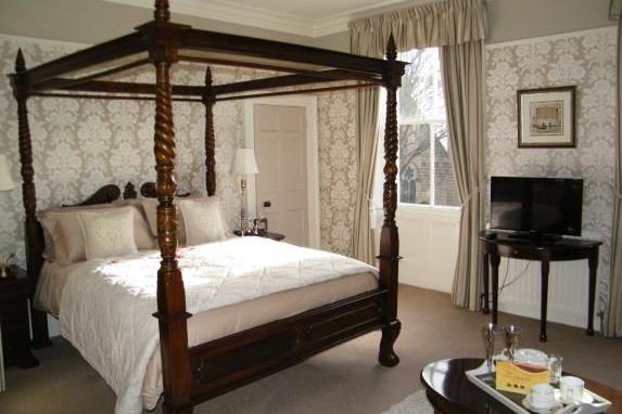 A four-poster bed in one of the eight bedrooms.