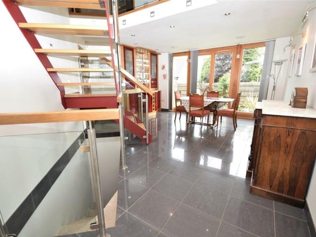 Into the dining room now at the prestigious Ravenshead property. The polished, tiled flooring and underfloor heating continues.