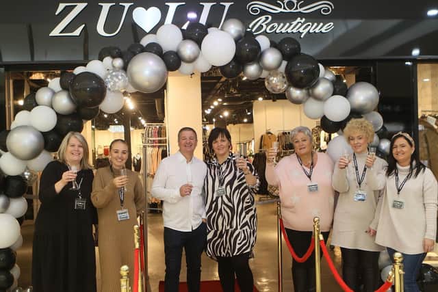 Owners Gary and Joanne Holmes with their staff at the new Zu-Lu Boutique store in the Four Seasons Shopping Centre.