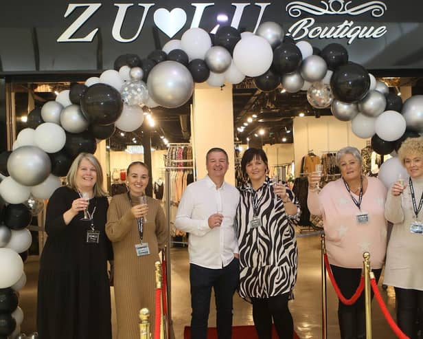 Owners Gary and Joanne Holmes with their staff at the new Zu-Lu Boutique store in the Four Seasons Shopping Centre.