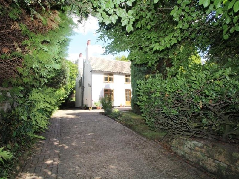 The house is set back from the road, giving a feel of exclusivity and privacy.