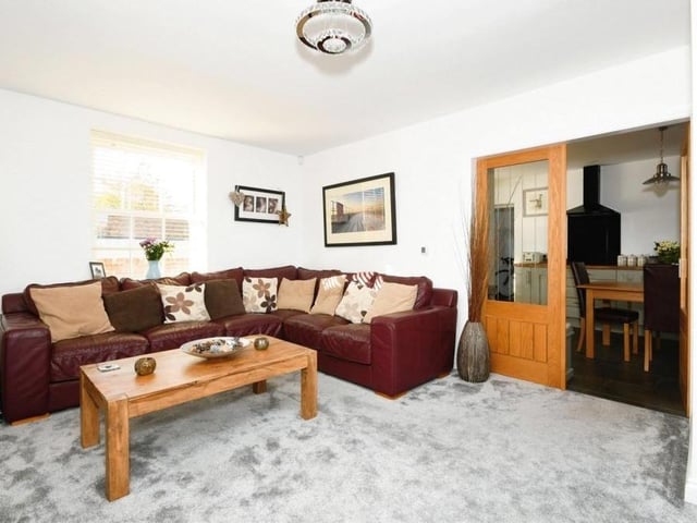 The ground floor boasts two reception rooms that could be used as a lounge or dining room. Here is the first, looking welcoming and comfortable.