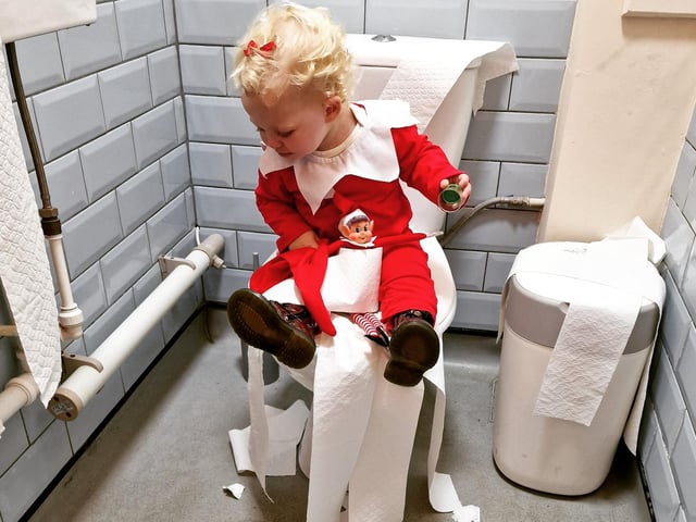Bubbles the Elf and the traditional Elf on the Shelf causing mischief wherever they go