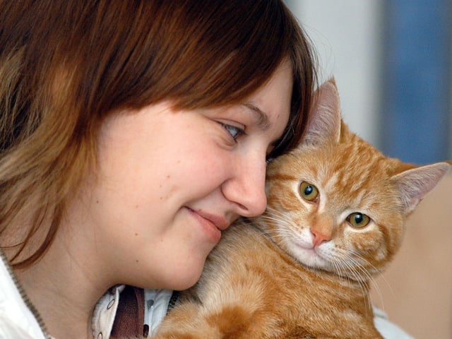 Kara Kemp with her cat Garfield who woke her up in their house fire in Stanton Hill.