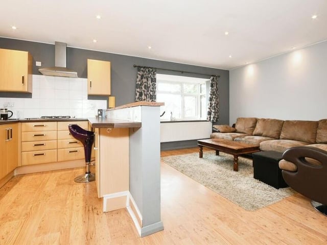 The open-plan lounge and kitchen within the annexe makes for a spacious and functional living space.