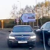 This is the dramatic moment a banned driver was sent spinning as cops rammed his BMW during the 100mph car chase.