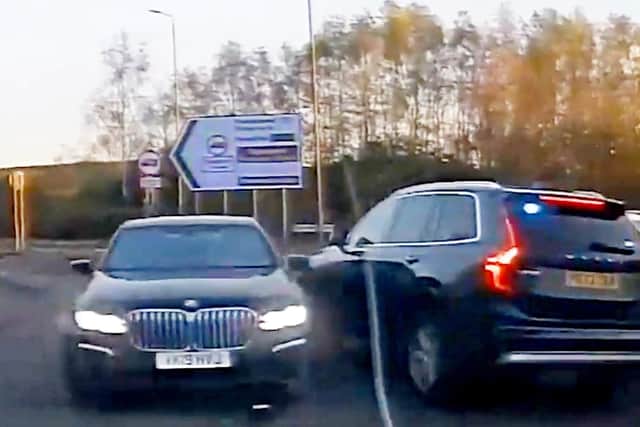 This is the dramatic moment a banned driver was sent spinning as cops rammed his BMW during the 100mph car chase.