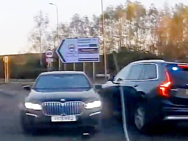 This is the dramatic moment a banned driver was sent spinning as cops rammed his BMW during the 100mph car chase.