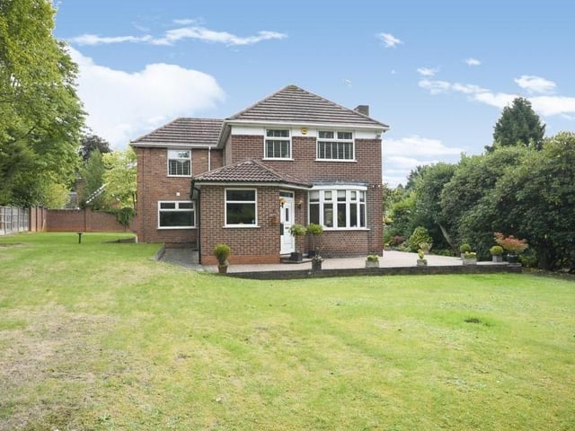 We complete our tour of the £800,000 Ravenshead property with a handful of exterior photos. This one shows the distinguished facade, with its large lawns.