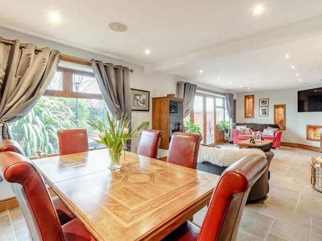 This is the dining section of the main open-plan reception room, complete with views of the garden.