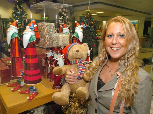 Jade Wilkinson the visual merchadising manager for house of Fraser was seen with some of the Christmas goods includiung the 2005 Fraserbear