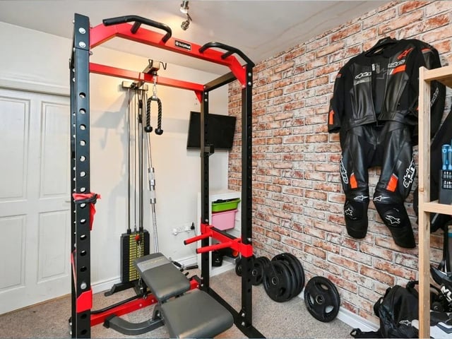 There’s also a gym and a side porch with double doors leading directly outside - ideal for busy family life or guests.