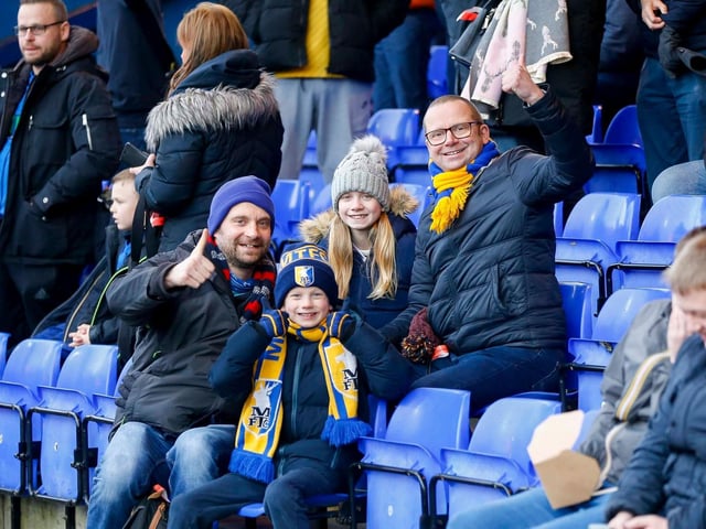 Mansfield fans at the Sky Bet League 2 match against Stockport County FC at Edgeley Park, 01 Jan 2024.
Photo credit should read : Chris & Jeanette Holloway / The Bigger Picture.media:Mansfield Town fans enjoy the win at Stockport County