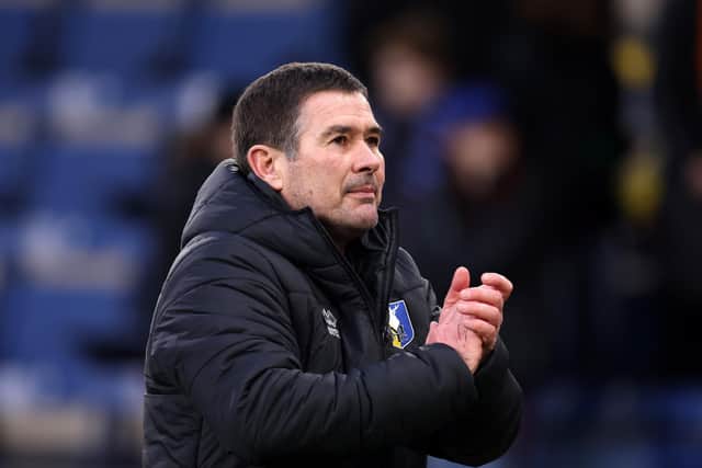 Nigel Clough acknowledges the fans following the teams victory in the Emirates FA Cup Fourth Round match between Burnley and Mansfield Town (Photo by George Wood/Getty Images)