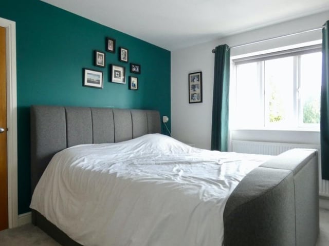 A second shot of the restful and relaxing master bedroom. The window faces the front of the Newlands Drive property.