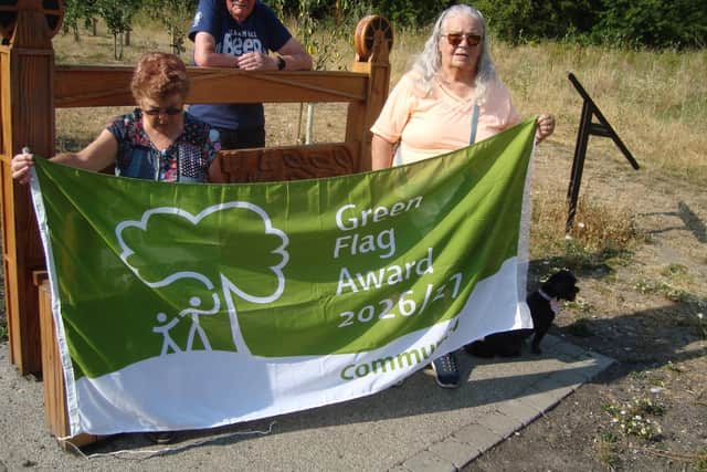 Members of the Friends of Brinsley Headstocks group prepare to proudly fly their Green Flag again. Photo: Submitted
