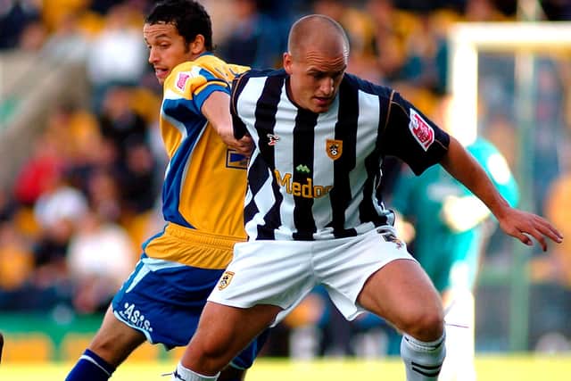 Mansfield Town's Gareth Jelleyman tussles with Notts County's David Pipe. Picture by Dan Westwell.