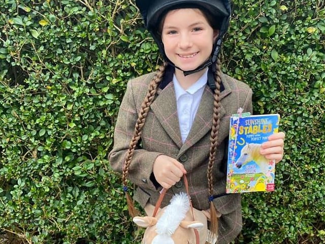 Kelly Marie sent us this photo of a young Sunshine Stables fan