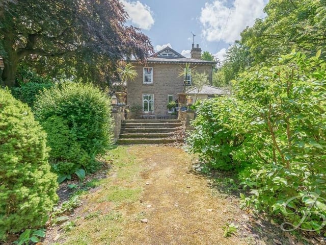 There's almost as much to look at outside as there is inside. So let's begin with this view of the back of the property from the sizeable garden.