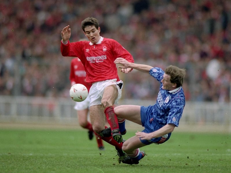 Nigel Clough is tackled by Kevin Moore of Southampton during the Zenith Data Cup final at Wembley Stadium in London in 1992. Nottingham Forest won the match 3-2.