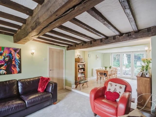The property is packed with original features including wooden ceiling beams.