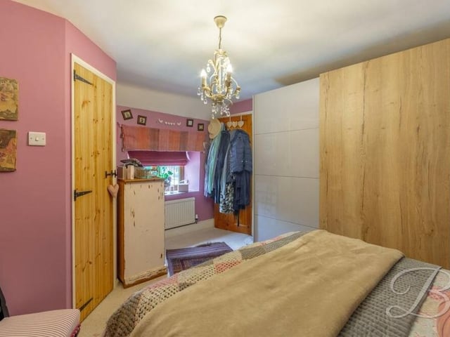 A second shot of the first bedroom, showing the built-in wardrobe.