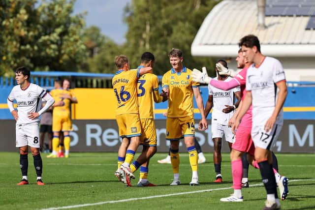 Mansfield Town midfielder Jon Russell (13) celebrates his second goal during the Sky Bet League 1 match against Luton Town FC at the One Call Stadium, 30 Aug 2026, Photo credit Chris & Jeanette Holloway / The Bigger Picture.media