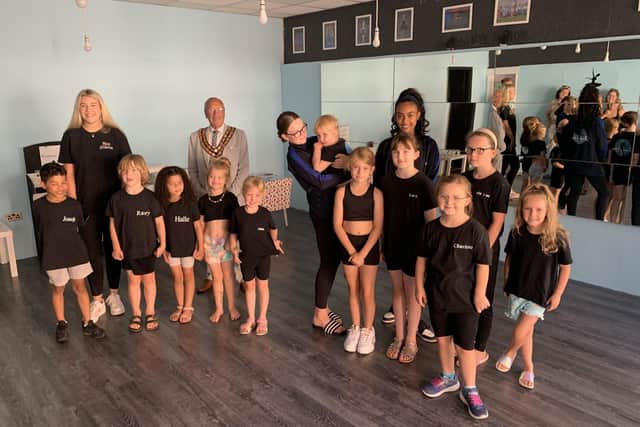 Staff and young dancers with the Town Mayor inside the new studio on Nottingham Road.