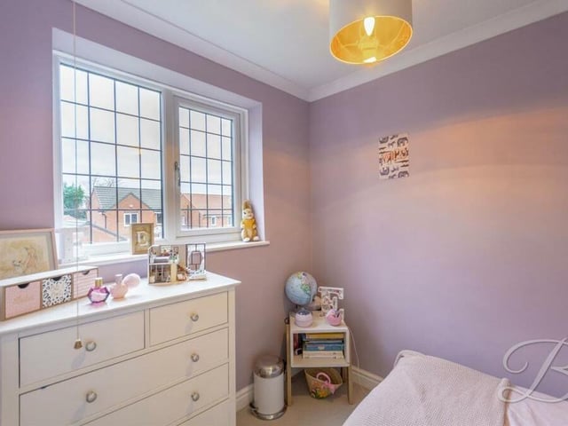 A second glance at the fourth bedroom, which has space for drawers and other storage.