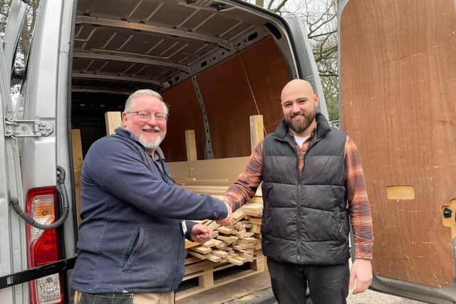 Chris Wynne (left), Trade Tutor at Portland College, collecting wood offcuts from Kieran Percival.