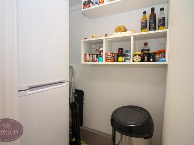 Just off the kitchen at the Chewton Street bungalow is this handy pantry.