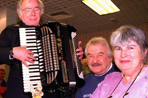 Accordion player serenades Bob and Pamela Scarfe from Loversall, 1998.