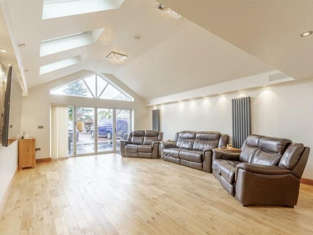 We launch our tour of the Forest Court bungalow in the impressive living room, which has an abundance of space for furnishings and homely touches. With its oak flooring, three skylights with remote-controlled blinds, apex window and two vertical radiators, it oozes style. There is also a wall-sunken surround-sound system, a log-burning stove and bi-fold doors leading outside.