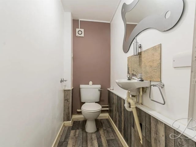 Fitted with a hand wash basin and low flush WC.