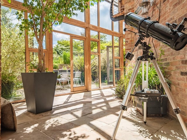 Clever architecture and design by the Joyces enabled the property to invite the outdoors inside. This garden room is a classic example.
