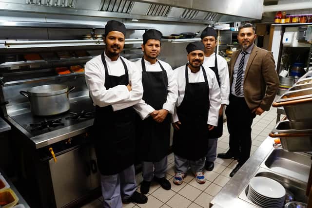 The restaurant turned around from 0 to 5 star hygiene rating. 
Owner Runu Ahad and his chefs.