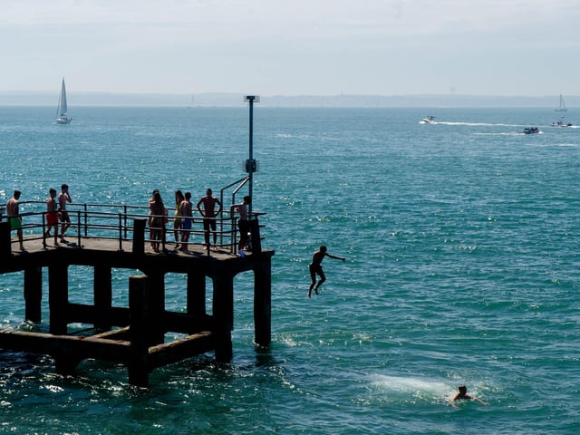 Teenagers jumping off the pier at Hotwalls, Old Portsmouth. Picture: Habibur Rahman