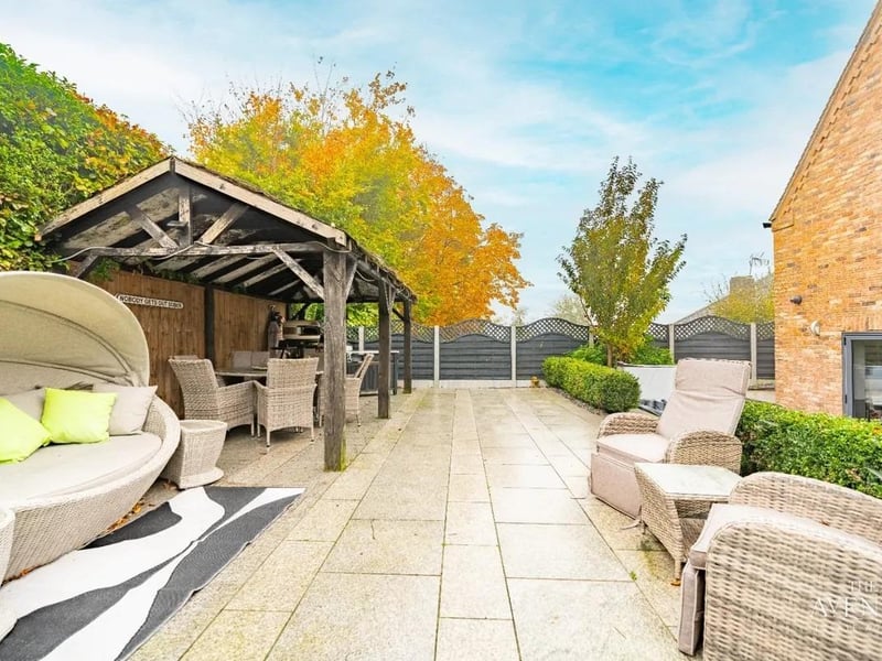 If you love privacy as well as entertaining, this garden has it all. This beautiful easy to maintain garden features a spacious patio area, a raised patio area featuring a gazebo.