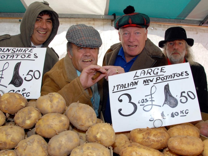 Mansfield Flea Market celebrated 25 years on Tuesday August 17, 2010, with an Only Fools and Horses event. Pictured are Del Boy impersonators Operations Co-ordinator David Bennett, centre left, and Mansfield Mayor Tony Egginton, centre right watched by trader Steph Powers, right, and Town Centre Manager Nick Turner, left.