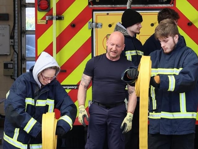 Hands On Experience of being a firefighter, students get to grips with laying a hose out at Ashfield Fire Station. Images Paul Horton