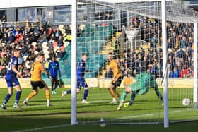 George Maris turns home the winner during the Sky Bet League 2 match against Newport County AFC at Rodney Parade 02 March 2024.Photo credit : Chris & Jeanette Holloway / The Bigger Picture.media