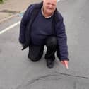 Coun Stephen Garner by the sink hole that appeared on Hall Street in Mansfield.