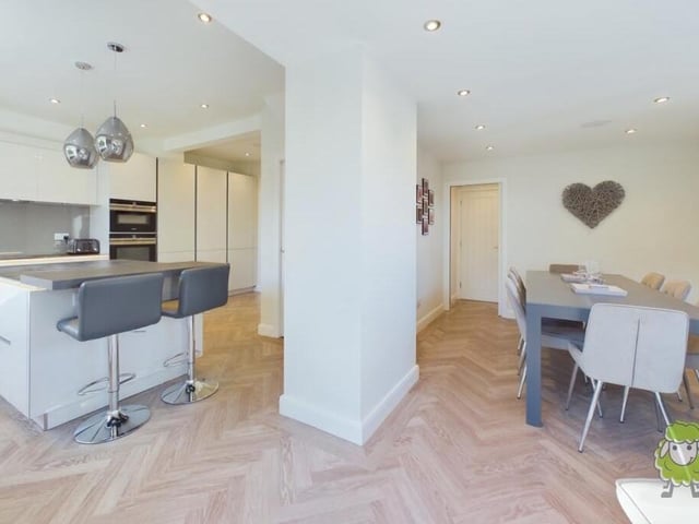The kitchen to the left flows seamlessly into the dining room on the right.