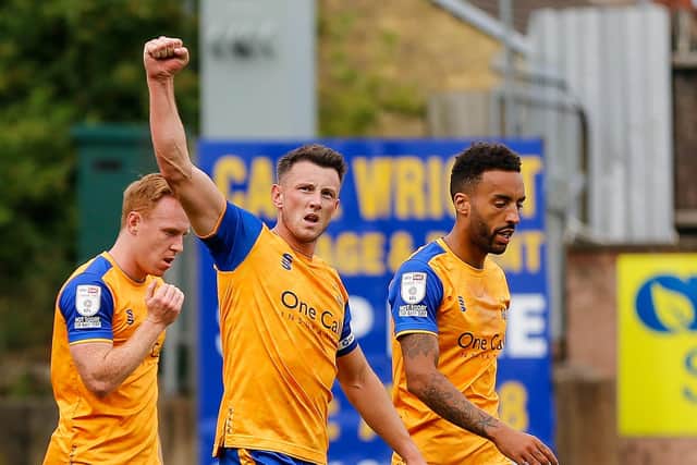 Ollie Clarke acknowledges the Mansfield fans after netting his winner.