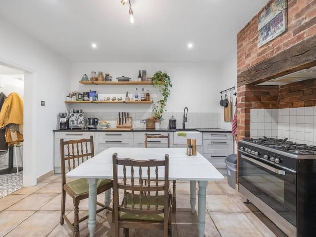 The kitchen features sleek countertops, ample storage space, and modern appliances. Whether you're a gourmet chef or a casual cook, this kitchen provides the ideal setting for culinary adventures.