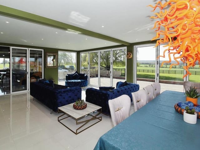 Comfort blends with style as the dining area fuses with living space.
