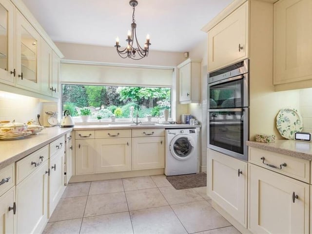 Next stop is the kitchen/breakfast room, with integrated appliances that include a Neff oven/grill and separate single oven, a Neff four-ring electric hob with extractor hood above, a Neff microwave, a fridge, separate freezer and dishwasher. There is plumbing for a washing machine too.