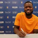 Deji Oshilaja puts pen to paper for the Stags.