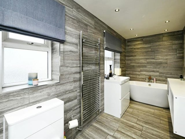 The family bathroom on the first floor has been refitted and revived. It is now a modern four-piece suite comprising a free-standing bath with central taps, shower cubicle, low-level WC and wash hand basin in a vanity unit. A porcelain tiled floor and walls, a heated towel-rail and recessed spotlights add to its appeal.